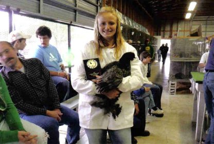 Kayle holding a Blue Cochin Chicken Hen purchased from Cackle Hatchery®. She won Best chicken in The Barn award at the Oconto county Fair, August 2009. Thanks Cackle!
