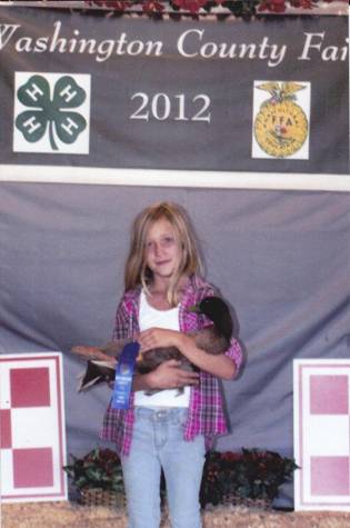 2012 Winner for Funny, Cute, Originality of Artistic Photo Brooke holding a Cackle Hatchery® Khaki Campbell Drake. Her first year showing and a great start in a 4H program.