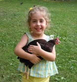 Emily with Grand Champion Rhode Island Red Bantam Hen. Thank you Cackle!