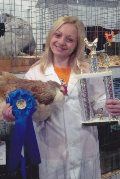 Our daughter, Kennedy showed her poultry at our local fair and placed Grand champion Standard Size Hen with her Faverolles Hen. This was her first year showing poultry. She placed 1st in her first heat, Continental Class. Then overall - Grand Champion Sta