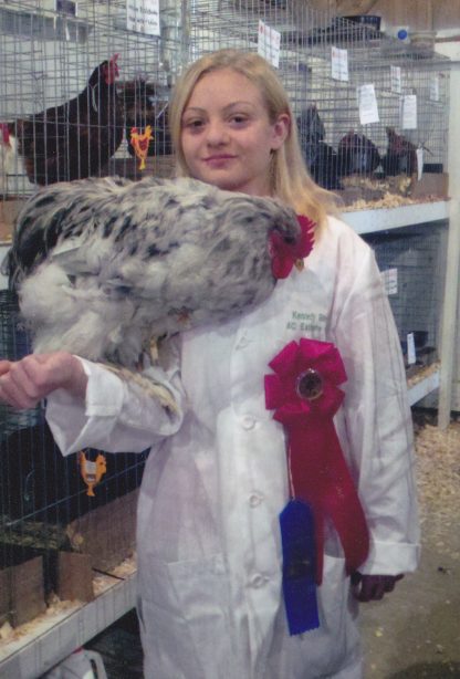 Our daughter, Kennedy's first year showing poultry at our fair. She received 2nd place in her Asiatic Class with her Splash Cochin Rooster.