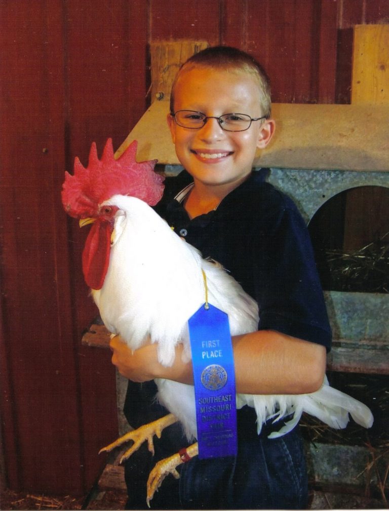 Steven, Cape Girardeau, MO with his Prize White Leghorn Chicken Rooster