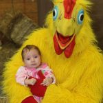 chicken costume holding baby