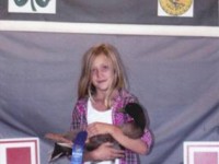 2012 Winner for Funny, Cute, Originality of Artistic Photo Brooke holding a Cackle Hatchery® Khaki Campbell Drake. Her first year showing and a great start in a 4H program.