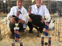 Turkeys with Children with trophies in front of them