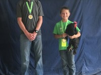 Boys' with prize winning chicken in 2018