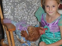 Chicken and Girl in Matching Costumes