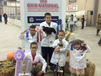 Kids displaying their ribbons and trophies at the Ohio National