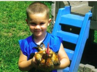 Kid with a Chicken
