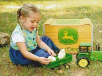 Girl with Chicks in a John Deere Tractor