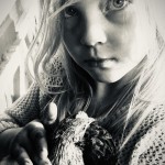 girl black and white with chicken