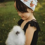 girl holding chicken