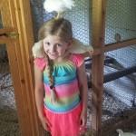 girl with chicken on head