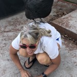 Chicken on woman's back.