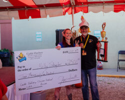 First Place Winner of Egg Eating Contest Molly with Jeff Check