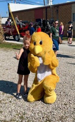 Chicken mascot with child