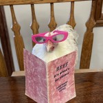 Chicken with glasses on reading book