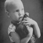 Child holding chicken