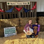 Savannah Scarborough - girl with grand champion turkey