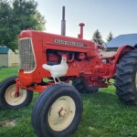 Taylor Schmitt - Chicken on Farm Equipment
