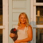 woman holding chicken