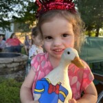 little girl holding duck